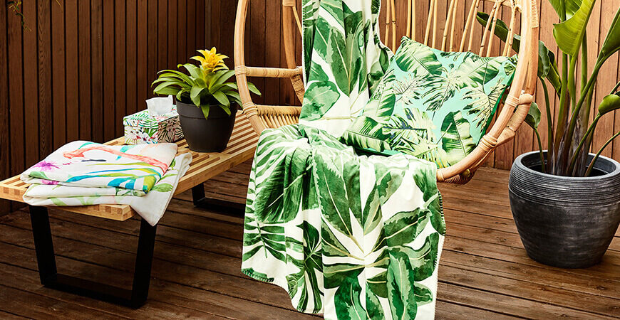 A chair and table with a plant on it