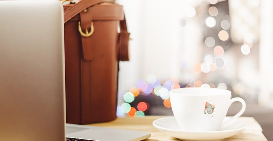 A brown purse sitting on top of a table.