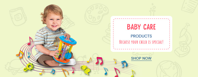 A baby playing with a toy on top of musical notes.